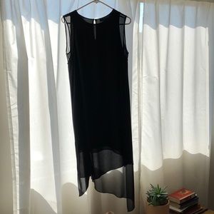 Black dress with sheer details at arms and hem